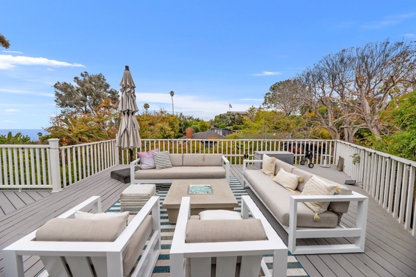 Lower third deck with lounge furniture and fire pit with gorgeous views.