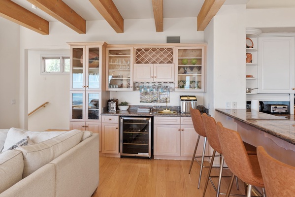 Bar area with wine fridge and ice maker