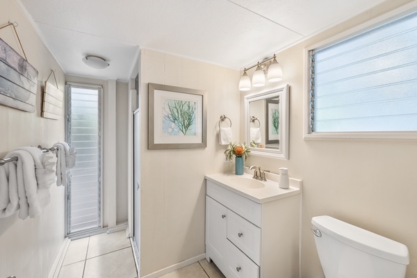 Bathroom off of back living/TV room and laundry room.