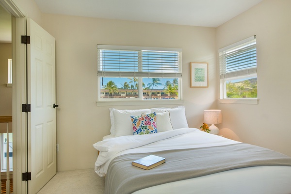 Second-floor queen bedroom with desk.