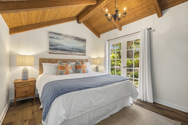 The fifth bedroom is in the cottage with a king-sized bed has doors that opens to the pool..