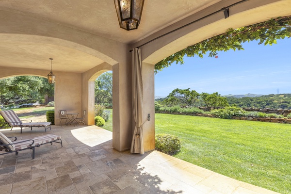 Gorgeous lawn and expansive views from the large covered backyard patio