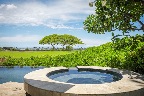 Lounge in paradise in the private spa with a waterfall feature into the stone set infinity pool.