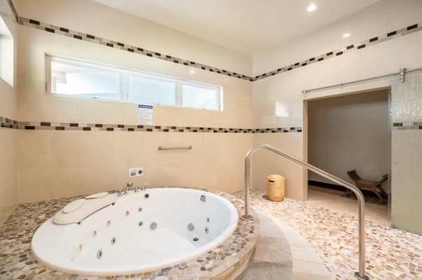 This bathroom also features a relaxing jacuzzi tub.