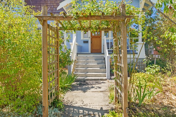 Relax and unwind under the garden pergola, a peaceful haven surrounded by lush greenery.