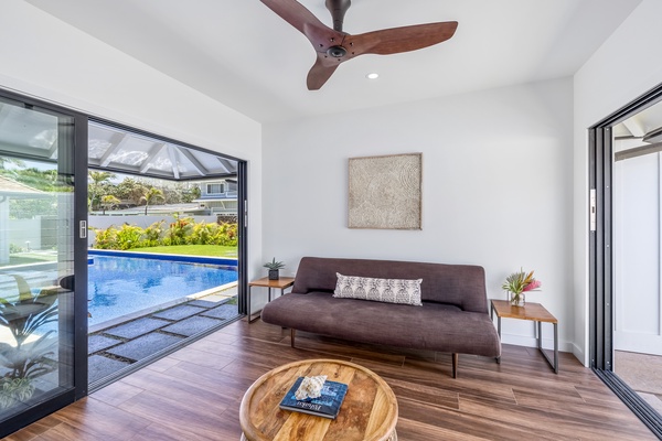 Bonus room with sleeper sofa and pool view