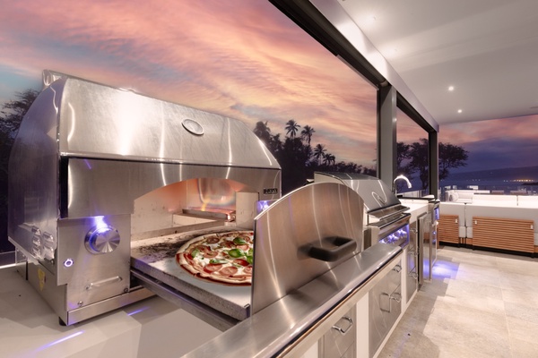 Dedicated pizza oven on the lanai, perfectly completes your luxury outdoor kitchen.