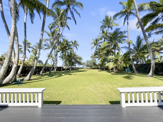 Enjoy views of the tropical landscape and ocean from the front porch