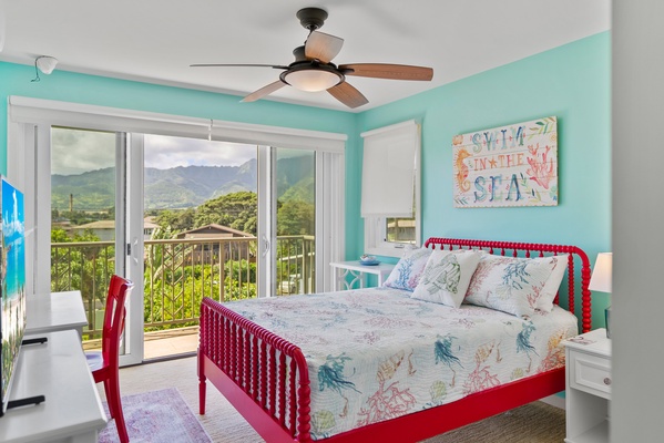 Queen bed in guest bedroom