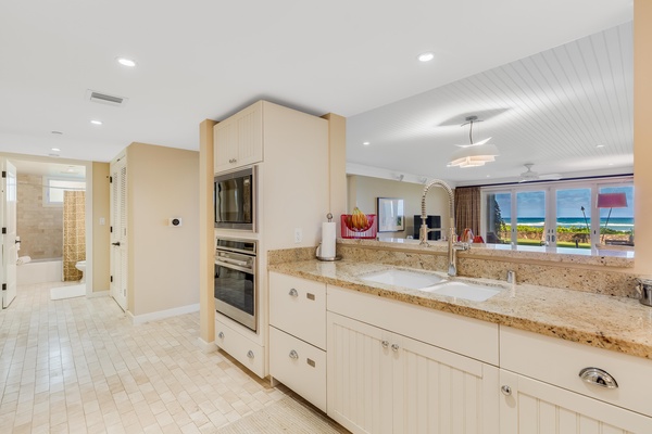 Kitchen overlooks dining and living area