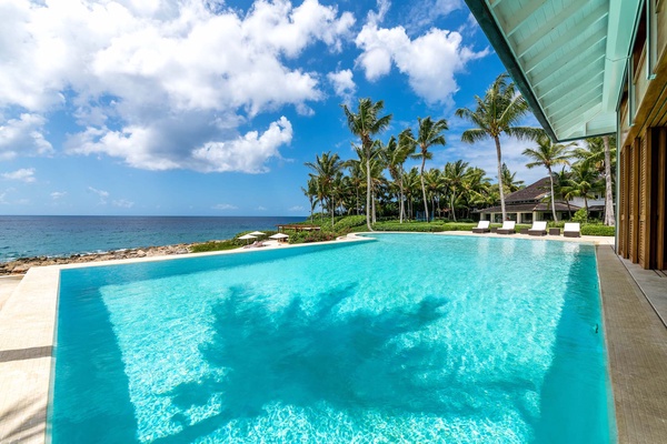 Swim in the stunning infinity pool with uninterrupted ocean views.