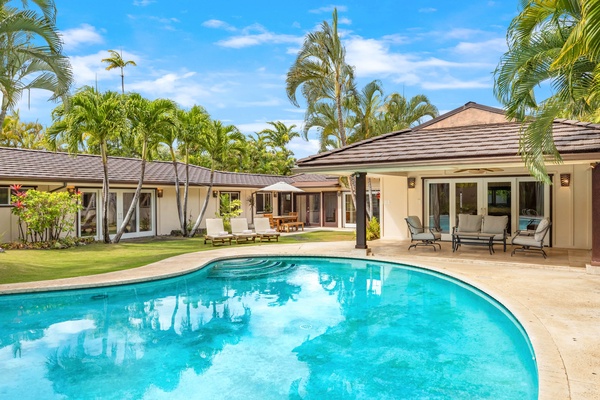 Inviting resort-style pool with crystal-clear waters, framed by a beautifully landscaped garden—your luxury retreat at home.