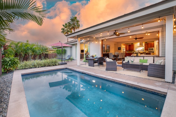 Huge pocket doors in the great room open to a covered lanai, the perfect setting for a morning cup of coffee, an afternoon nap, or an open-air dinner.