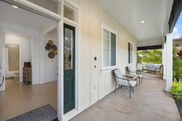 Inviting front porch with comfortable seating, perfect for relaxing.