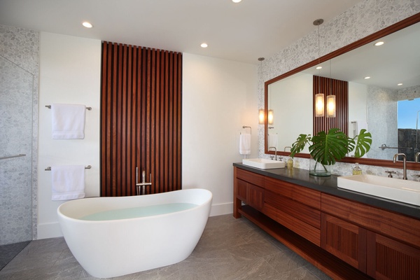 Primary 2 bathroom with soaking tub and outdoor lava rock shower.