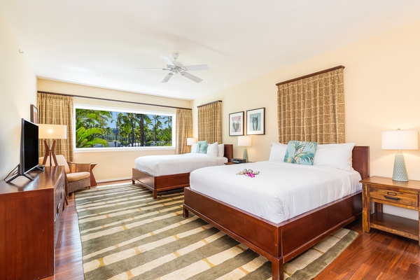 Guest bedroom with 2 Queen-size beds. For added flexibility, the living room also has a full-size sleeper sofa for additional space.