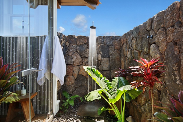 Primary Suite outdoor lava rock shower