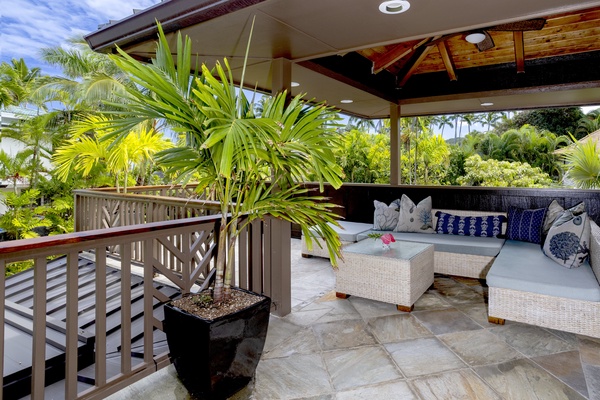 Private lanai in the primary ensuite with daybeds for outdoor relaxation