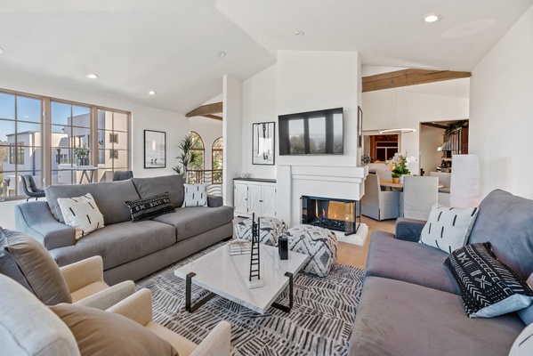 Open living space with passage to the dining area and kitchen makes room for everyone to enjoy.