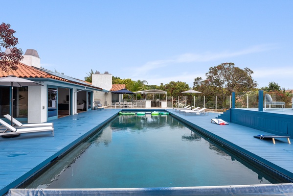 Huge solar heated pool with oversized hot tub.