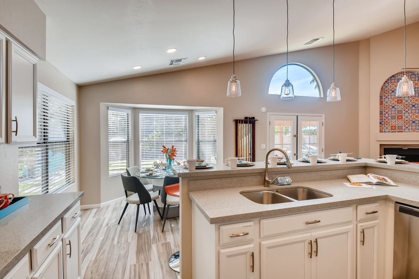 The kitchen is just off the great room and patio area making it the perfect open concept layout.