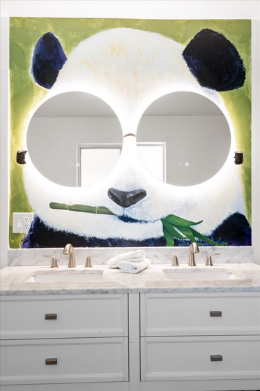 This incredibly unique bathroom has an awesome mural of a calming panda!