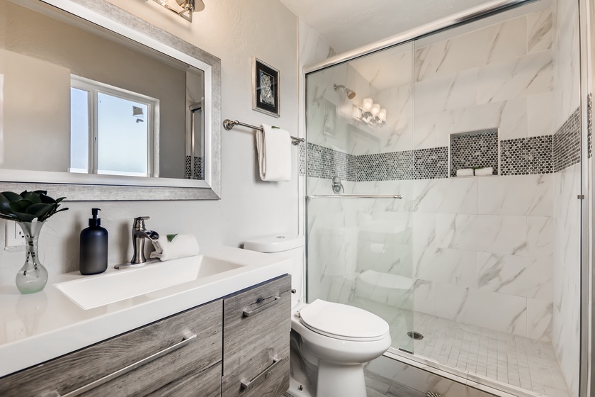 The en-suite master bath offers a walk-in shower