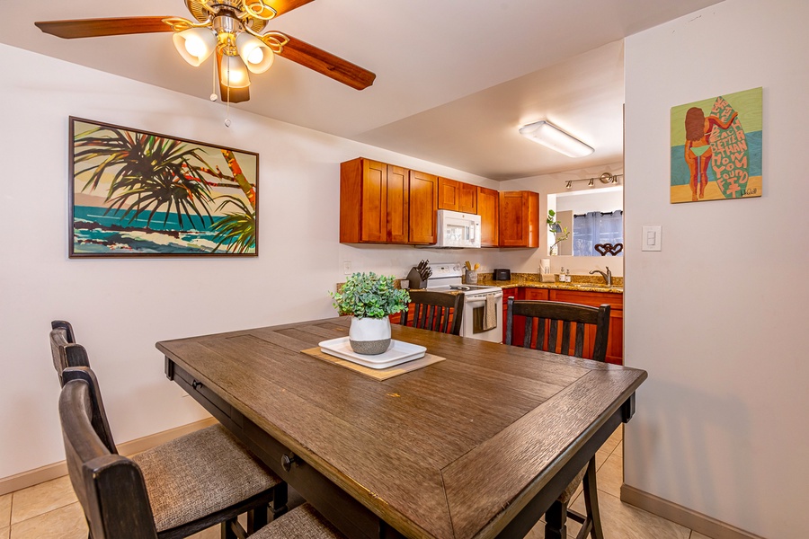 Dining table is adjacent to the kitchen for ease of use