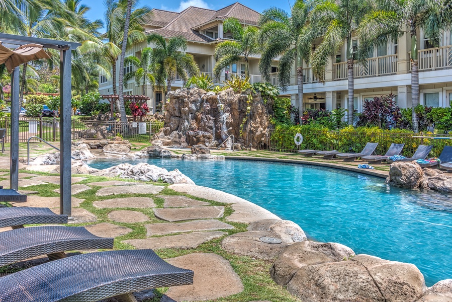 A waterfall at the pool awaits you