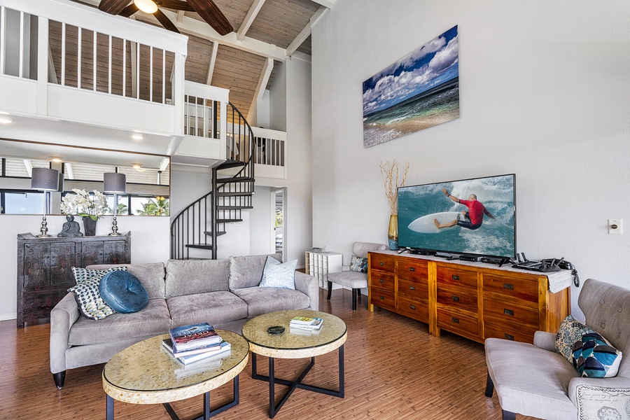 Living room with fans~ ample seating and stairs to loft 