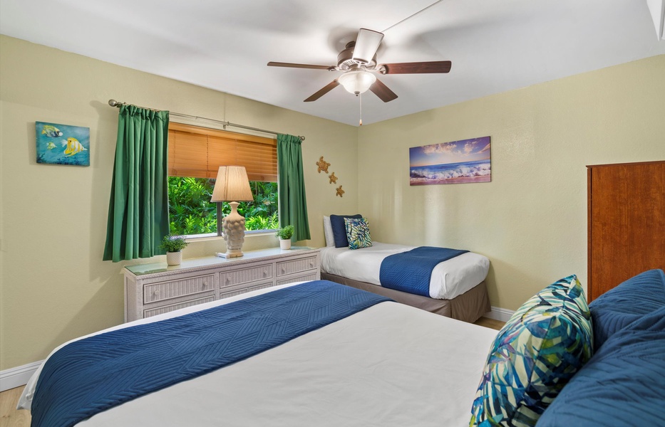 Guest bedroom features a twin and queen bed