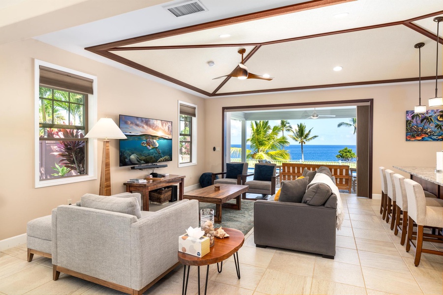 Spacious living area with views opens up to the lanai