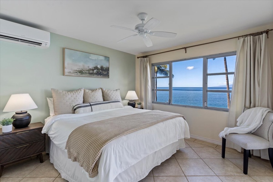 A king bed in the primary bedroom with an amazing view