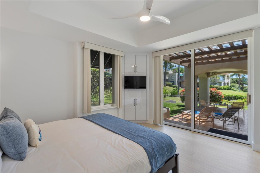 Primary bedroom features a King bed and access to the lanai