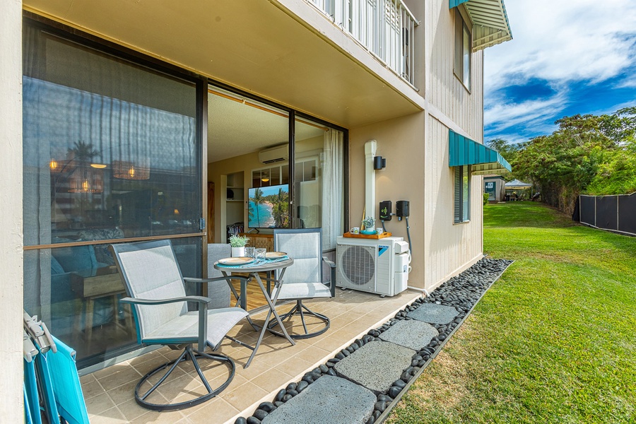 Ground floor lanai features seating for two