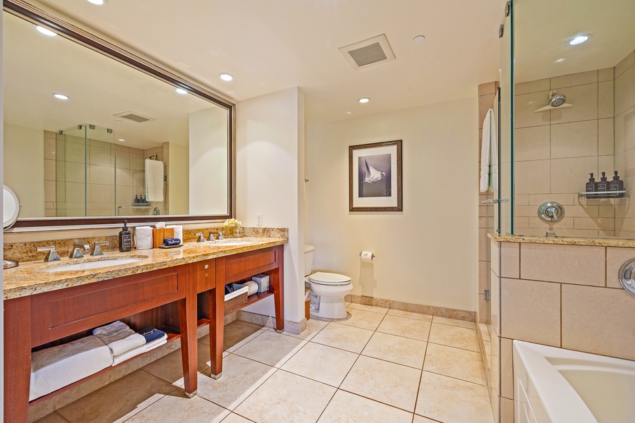 Spacious bath at Honua Kai Konea 206 with double vanity and walk-in shower.