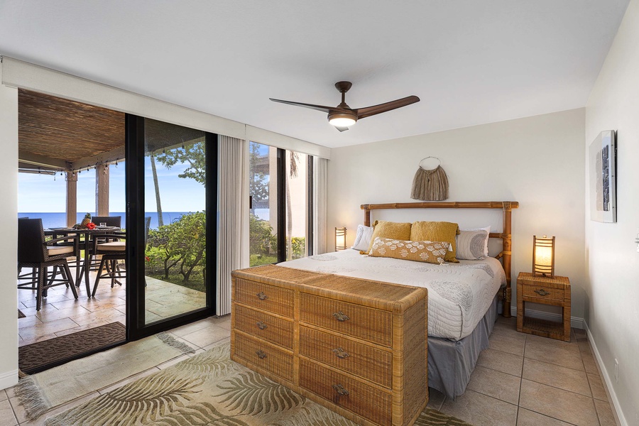 From the lanai, you can enter the spacious primary suite through a separate set of glass sliders.