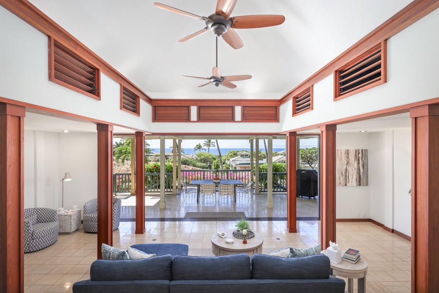 The spacious great room offers expansive colorful views and extends out to a large covered lanai with dining for six