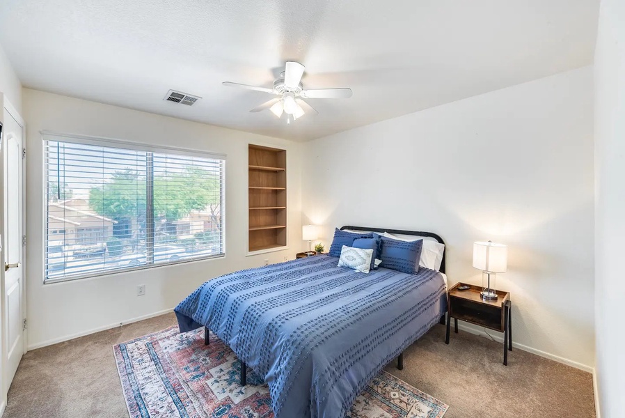 Another guest bedroom with queen bed