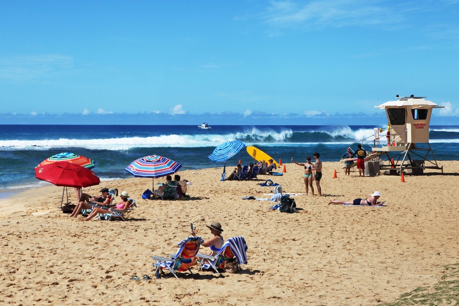 Relax in the sun and listen to the ocean waves at Poipu Beach Park.