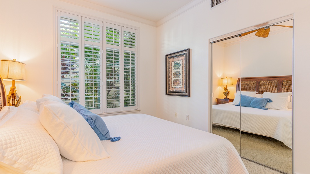 The third guest bedroom with cozy surroundings and soft linens.
