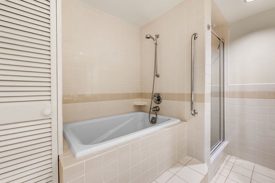 The ensuite bathroom has shower/tub combo.