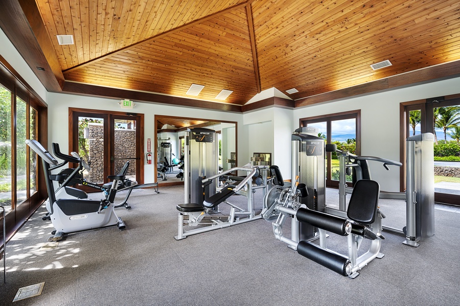 Stay active with a workout at the fully equipped fitness center, where you can lift, stretch, or cycle with views of lush tropical greenery.