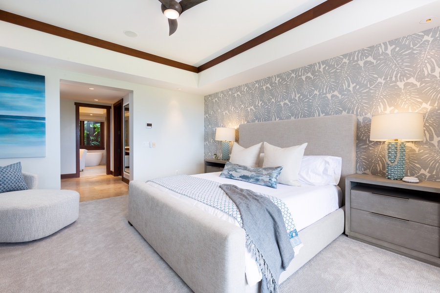 Alternate view of the primary bedroom towards the walk-in closet and entrance to the ensuite bath