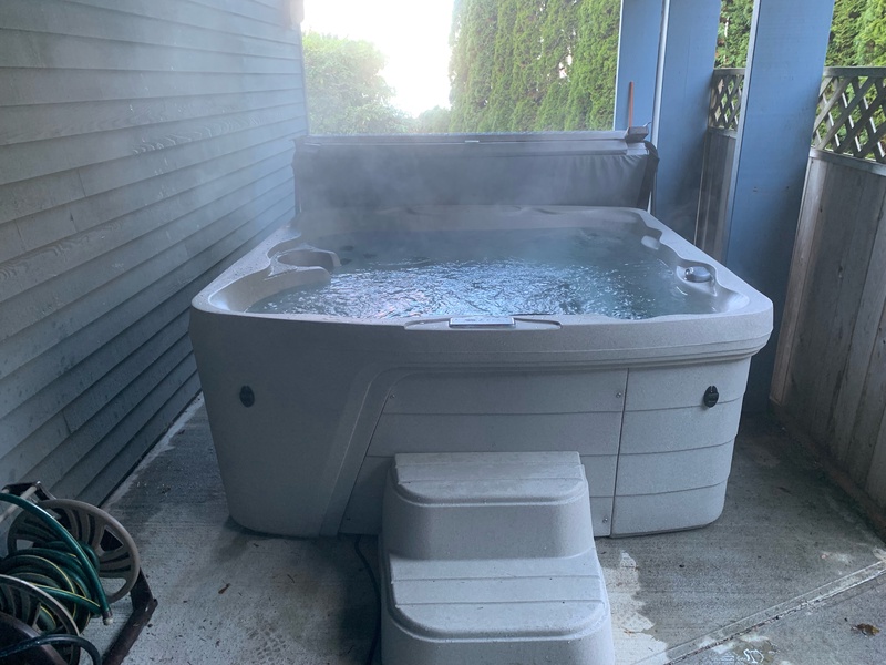 Private outdoor hot tub ready to provide a luxurious soak.
