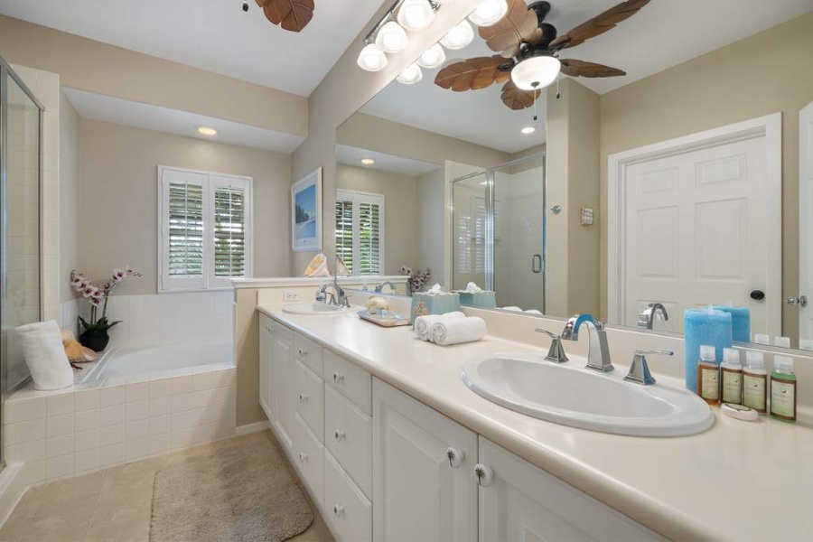 The primary guest bathroom with a soaking tub and double vanity.