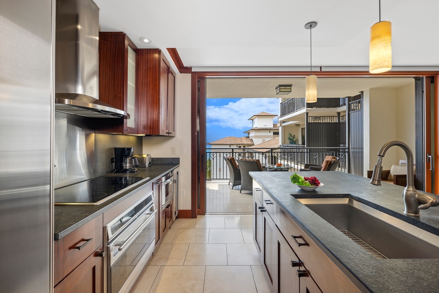 Fully stocked kitchen with stainless steel appliances is a chef's delight.