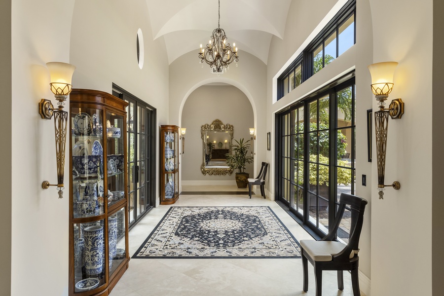 Elegant interior space featuring tall black-framed French windows.