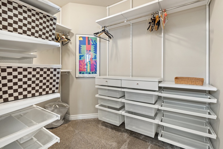 A walk-in closet, an organized haven to effortlessly store and showcase your cherished wardrobe