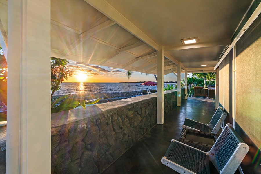 Covered breezeway with shaded lounge seating and ocean breezes.